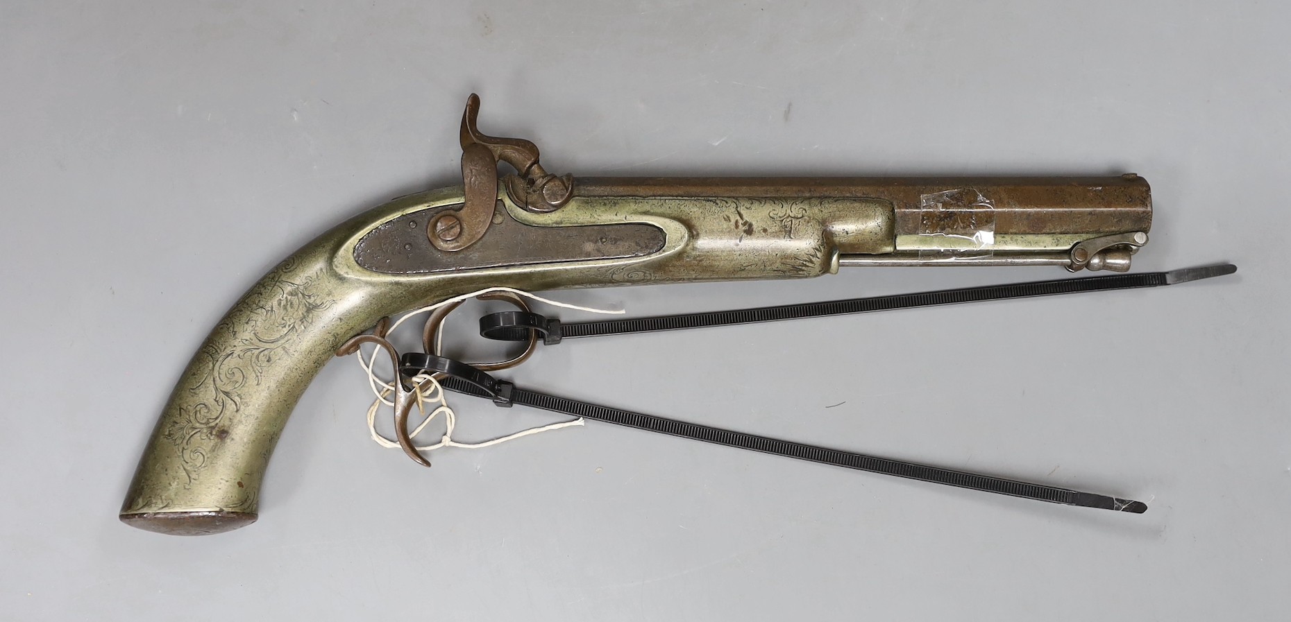 A 19th century Continental engraved brass and steel percussion pistol,32 cms long